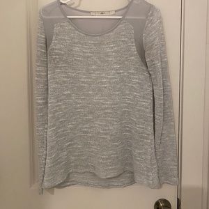 Sheer at the shoulders sweater material everywhere else